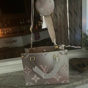 Beautiful leather designer purse 13x7 light pink and brown.